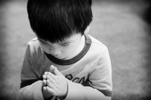 little boy in prayer