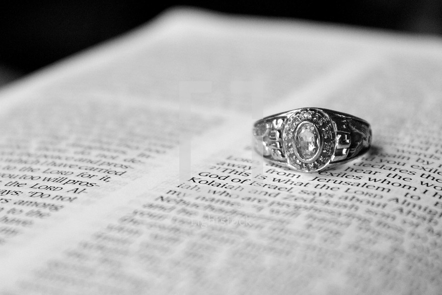 Class ring on page of open Bible.