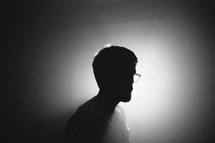 silhouette of a man in glasses 