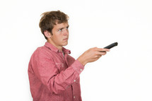 Man holding a remote control. 