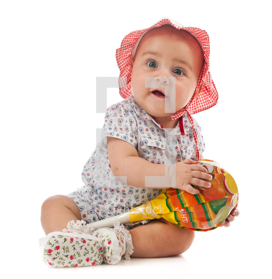 Portrait of cute female toddler isolated on white background