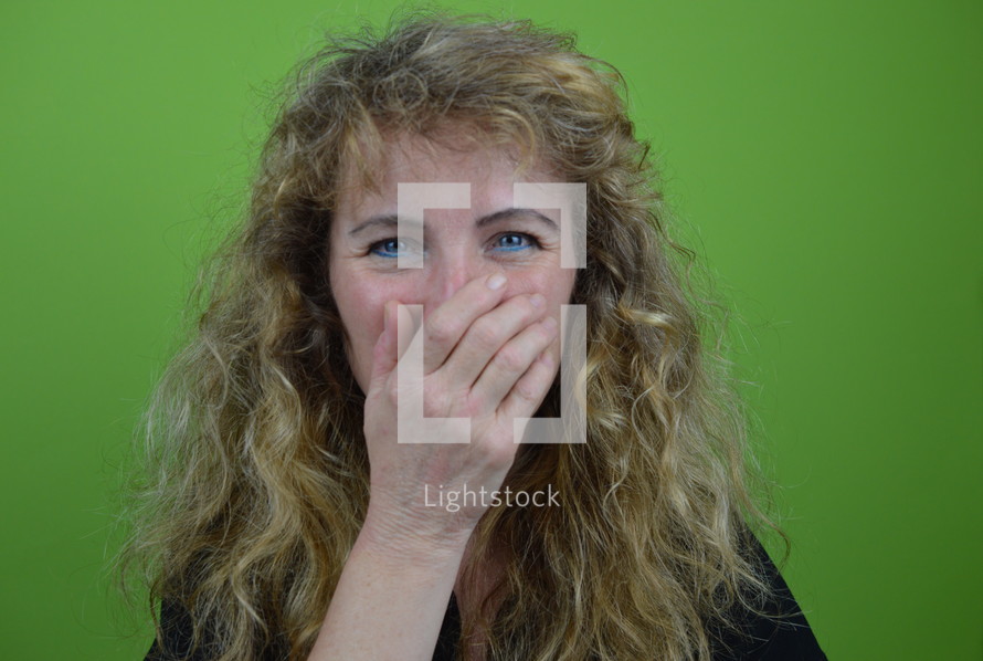 woman covering her face with her hand 