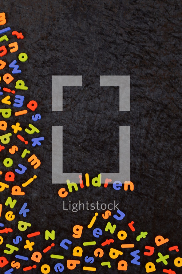 the word children in colorful magnetic letters 