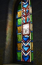 stained glass window with praying angels 