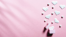 Pink background with white hearts 