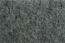 fiber texture - close-up of green and gray sponge surface as texture background