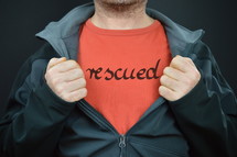 a man with the word rescued on his red t-shirt 