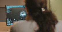 Researcher watching results of an MRI tests