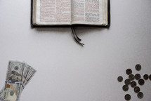 edge of a Bible and money 