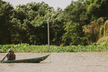 man on a boat in a Cambodia 