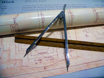 Blueprint plans and compass of an Architect or Engineer designing a building construction project where plans and blue prints are laid out to design a building or structure. The Architect of life has plans for our lives too if we just trust Him. He has a perfect plan and design for our lives that we may not often see but the builder and engineer of all life knows the plans He has for Us. Plans for us to prosper and not fail as mentioned in Jeremiah 29:11. 