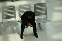 man waiting in an airport 