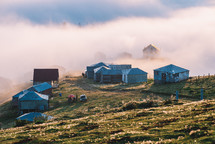 Houses in the foggy mountain