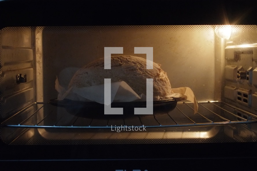 Making bread - dough baking in the oven