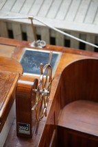 Wooden boat with steering wheel