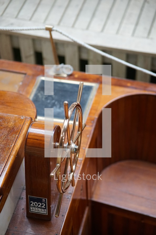 Wooden boat with steering wheel