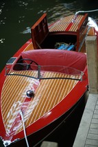 Red wooden boat on the water