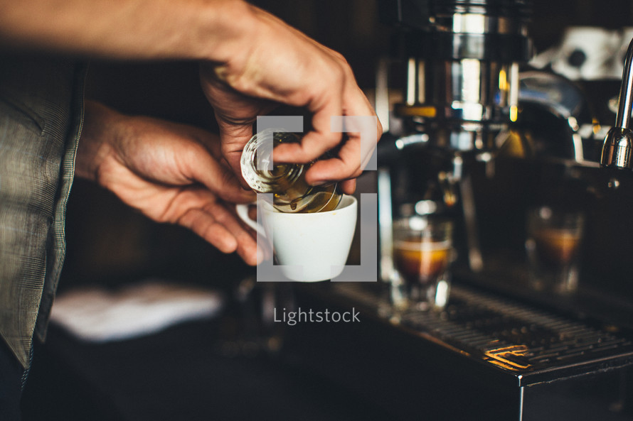 barista making an espresso shot 