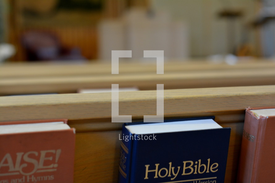 A Bible in the back of a pew 