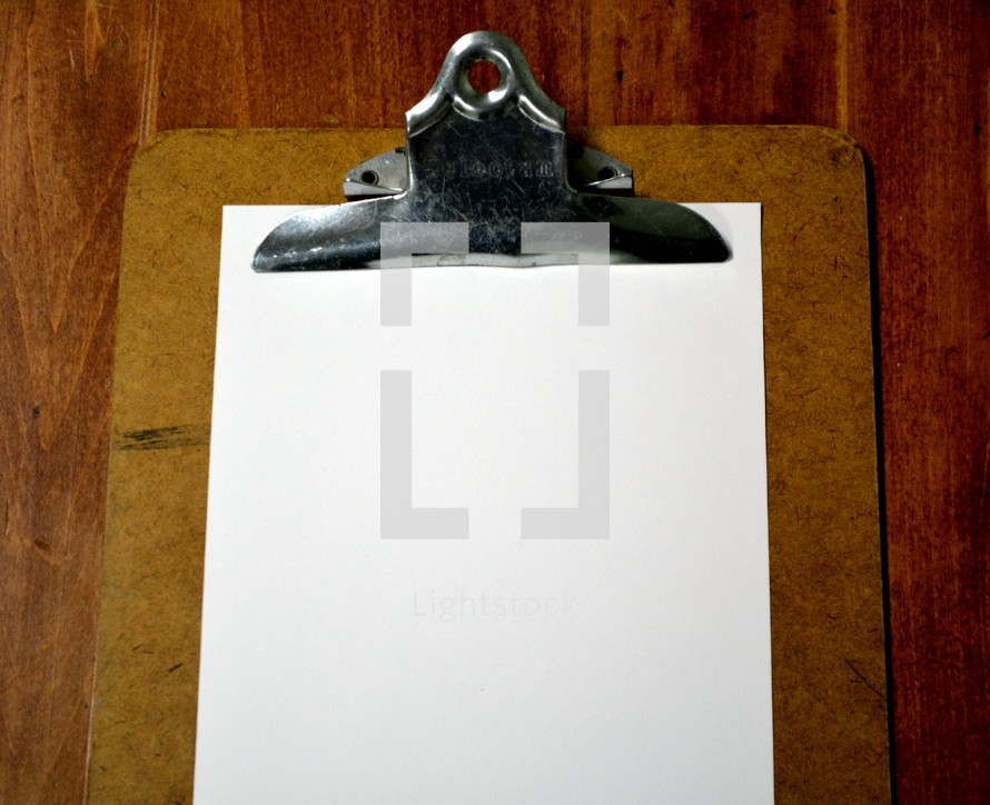 blank paper on a clipboard 