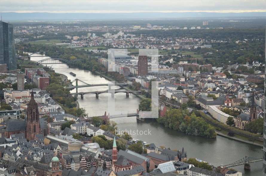 aerial view over a river through a city 
