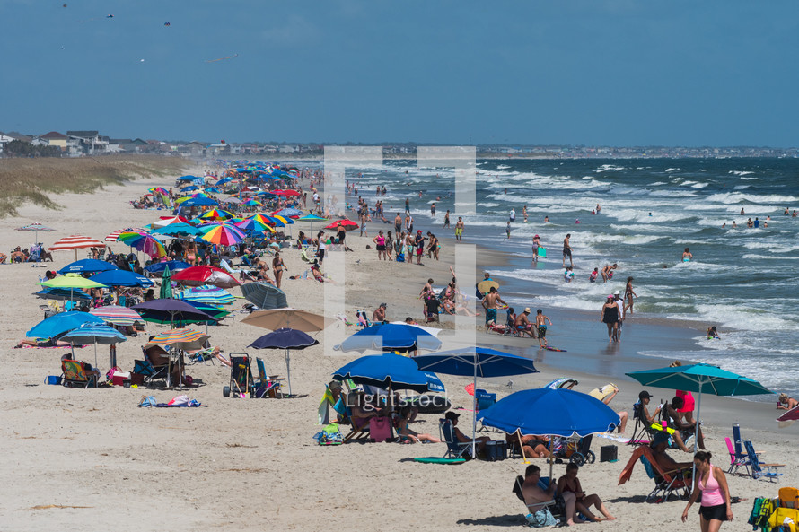 Sunbathers and vacationers on Ocean Isle Beach, North Carolina