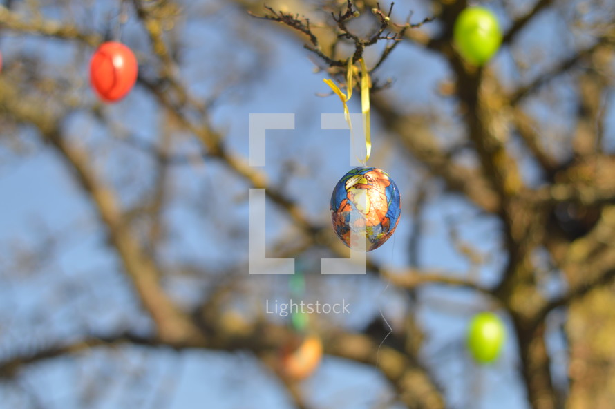 Easter eggs hanging on tree branches on an Easter egg tree 