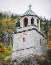 Church in the autumn forest