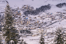 Snowy mountain village in the evening