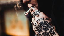 tattooed hands smoking 