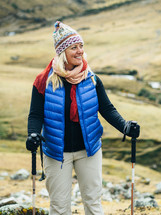 woman hiking with hiking sticks 