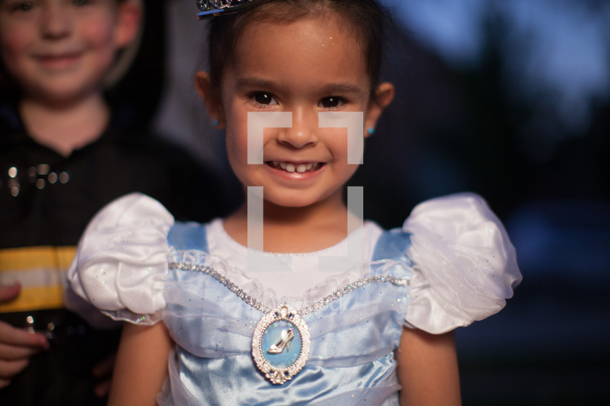 a little girl in a princess costume for Halloween 