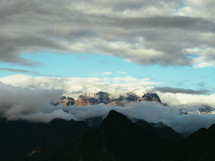 mountain peeking above the clouds 