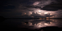 A lighting storm rolls over the Amazon river at night.