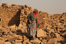 exploring, ruins, stacked, piles, stones, rocks, crumbling, walls, woman, India, traditional clothing, head scarf