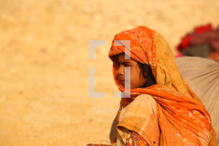 refugee resting in the desert 
