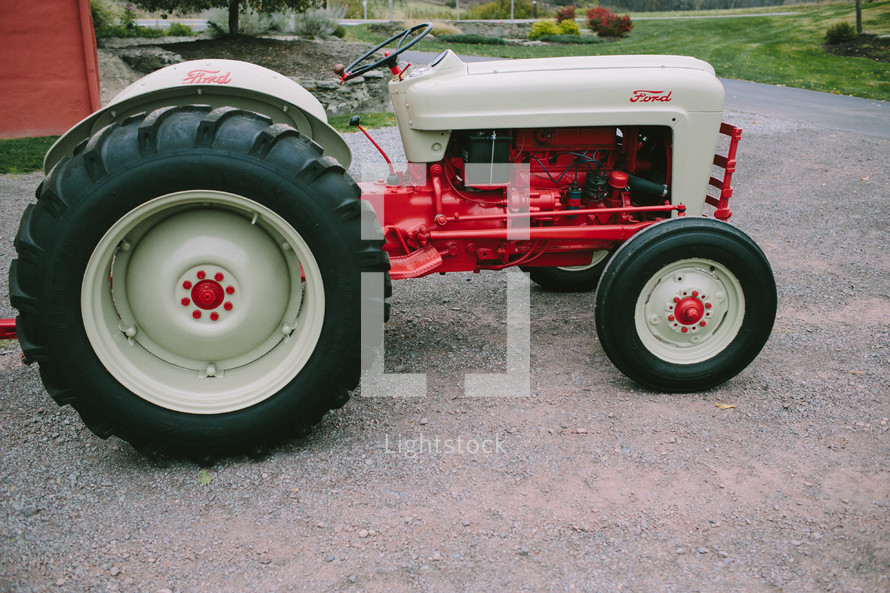 red and white Ford tractor 