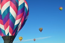  hot air balloons against blue sky 