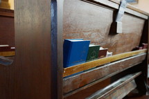 hymnals in the back of church pews 