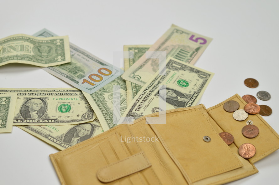 cash spilling out of a wallet 