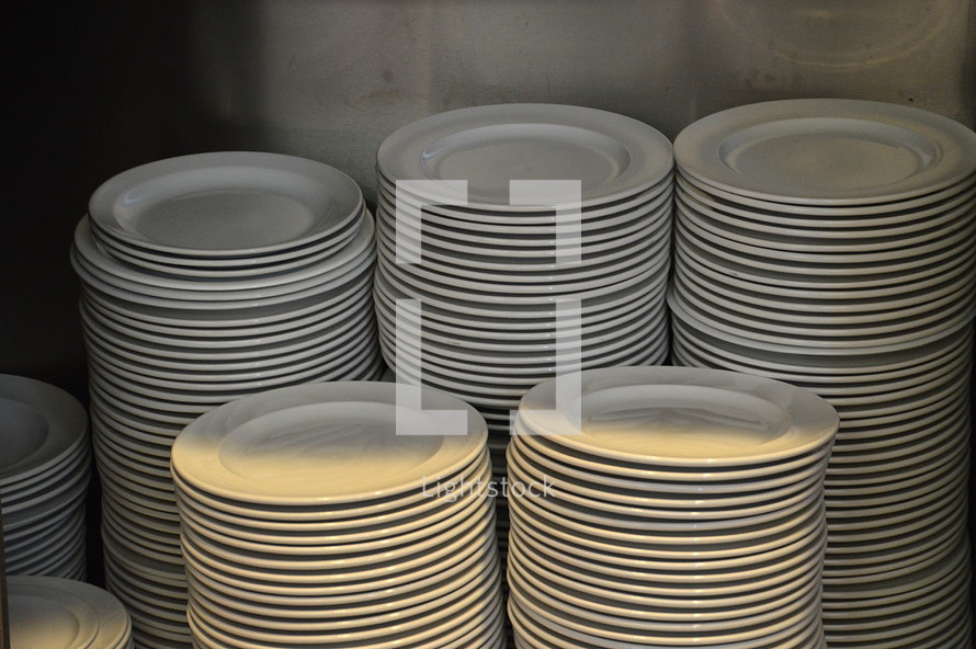 piles of plates – food for many people. 
