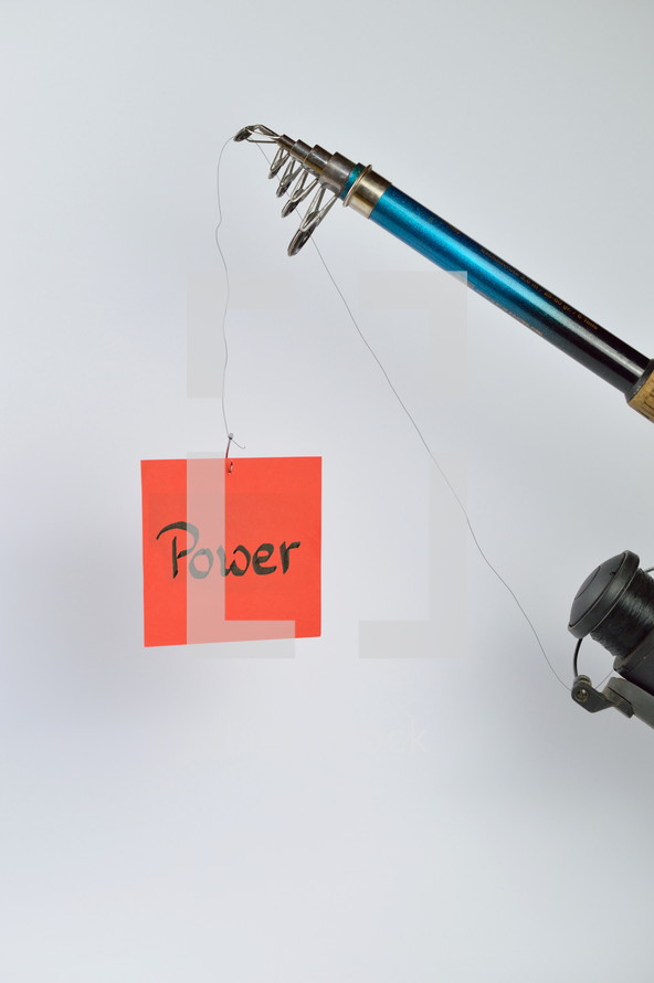 the word power on a red piece of paper hanging from a fishing line 