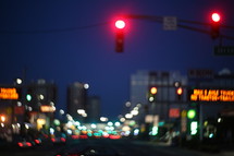 stop light in a city at night 