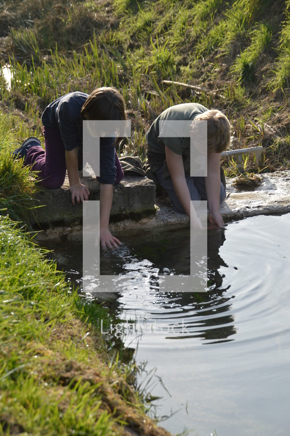 boys playing in water 