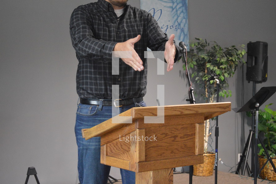 pastor preaching from a pulpit 