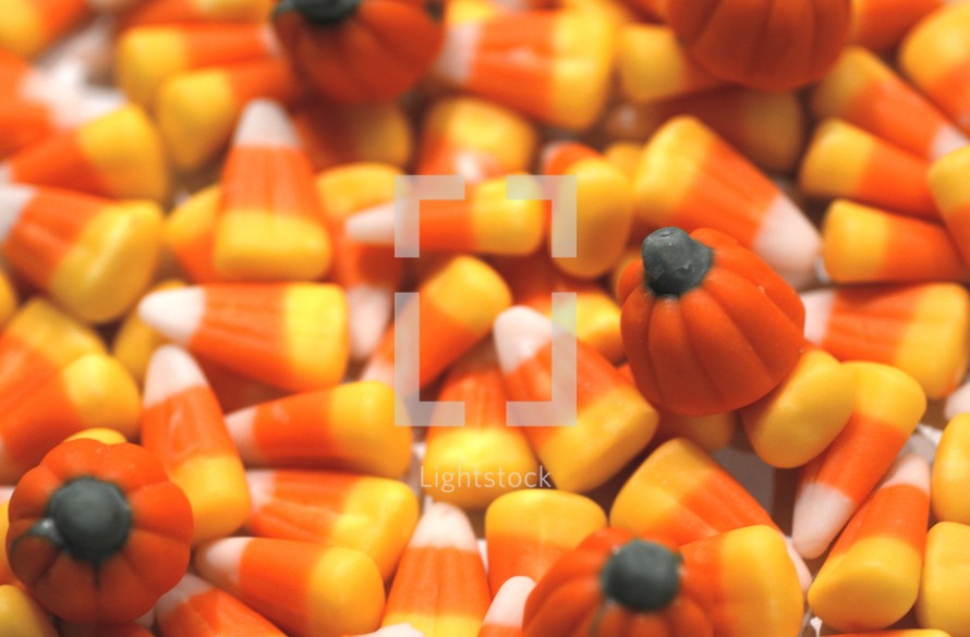 pile of candy corn and candy pumpkins 