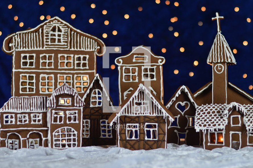 home made gingerbread town with bokeh sky out of blue velvet and christmaslights