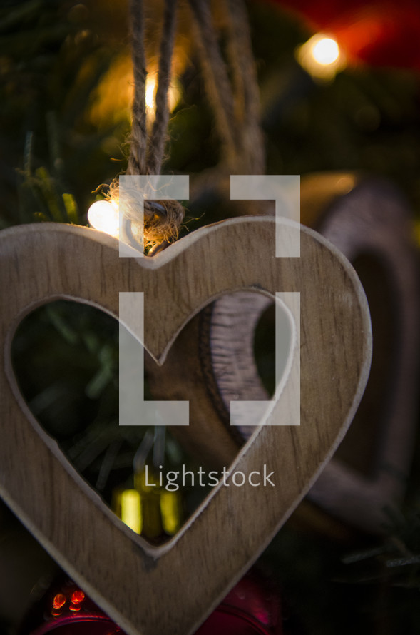 wooden heart Christmas ornaments on a Christmas tree