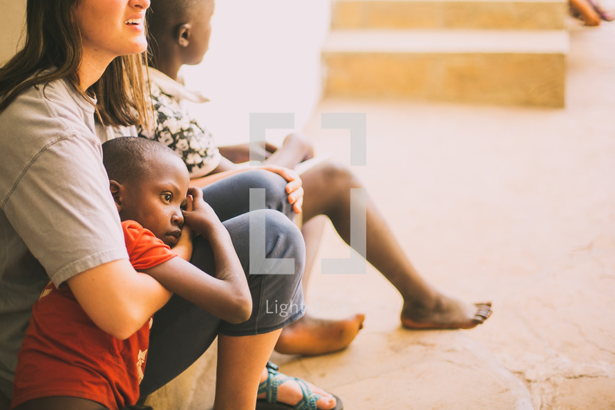 missionary hugging a child in Kenya 