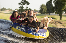 summer fun with an inner tube and slip and slide 